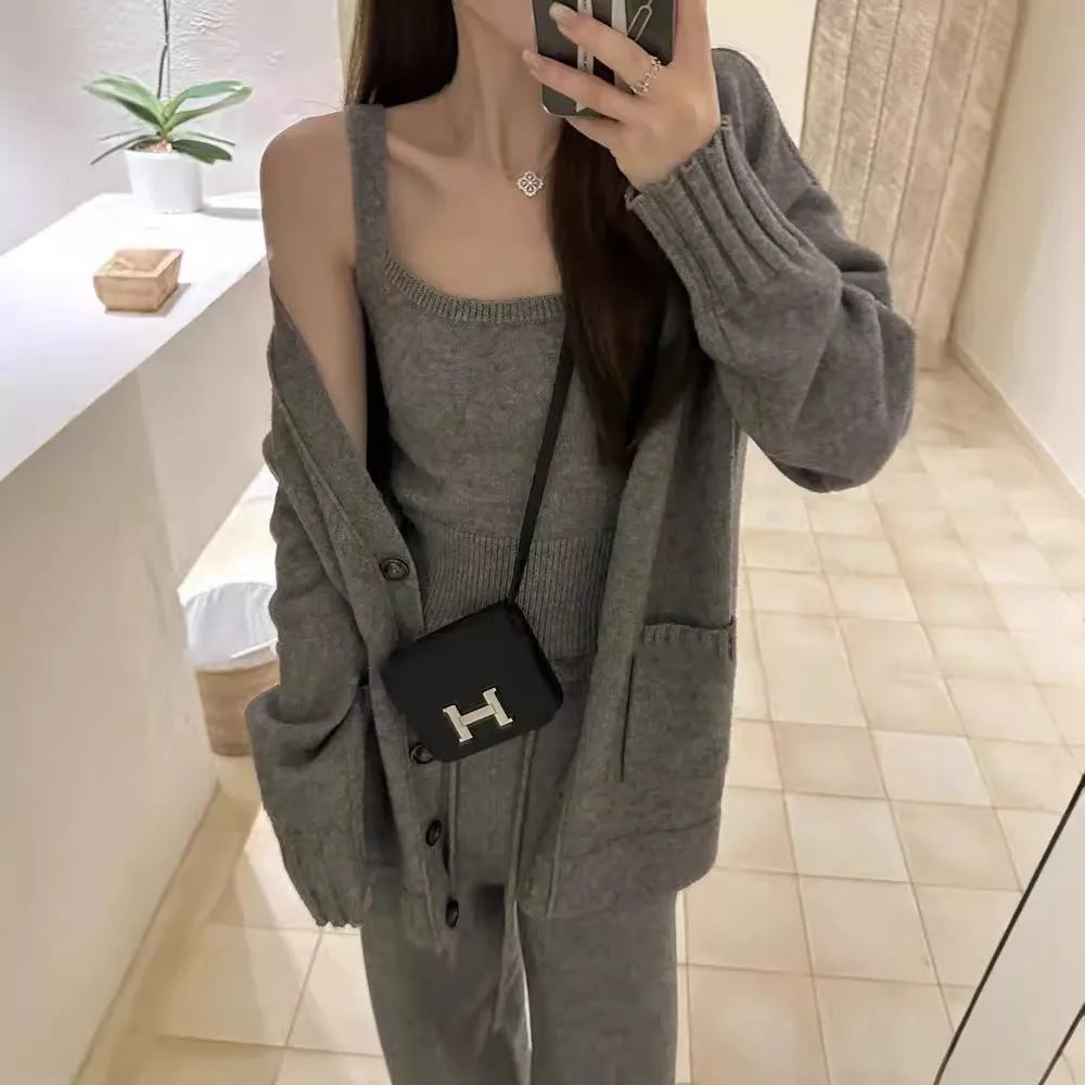 Women's loose-fit knit cardigan, vest, and trousers three-piece set in wool blend fabric.