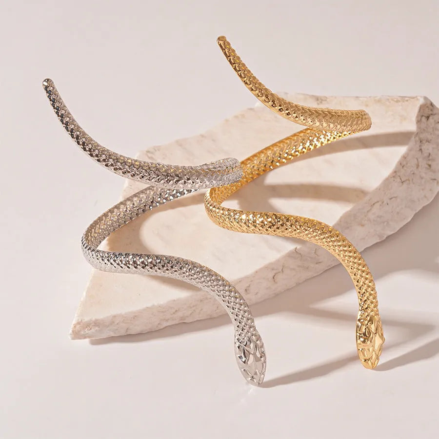 Gold tone simulated snake jewellery set with twisted winding ring and bracelet