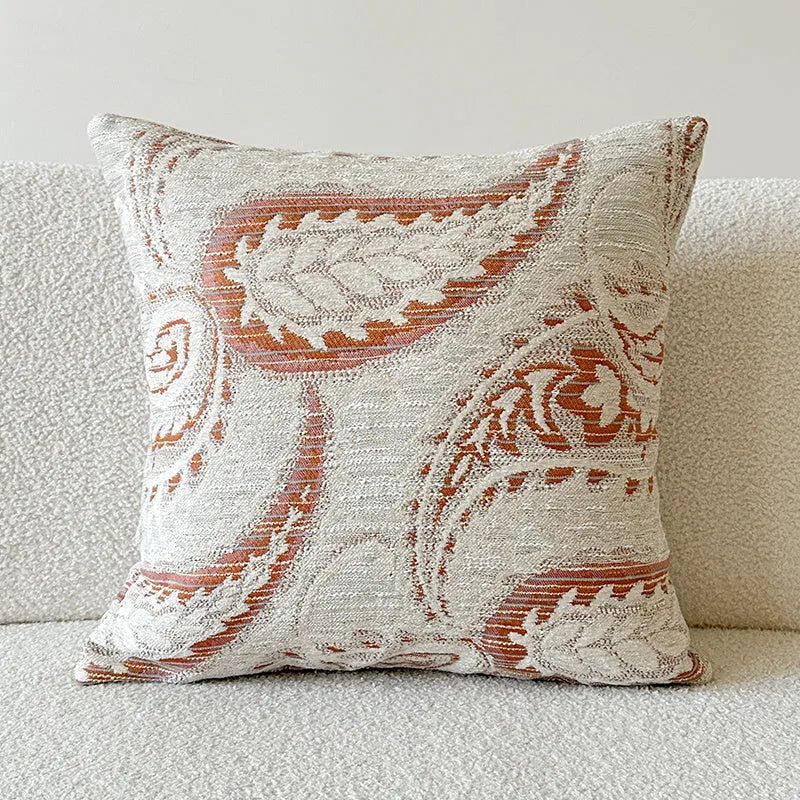 American-style yarn-dyed jacquard pillow cover with paisley pattern in amber colours on sofa