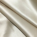 Dark grey 19 momme mulberry silk pillowcase showing envelope closure on a bed.