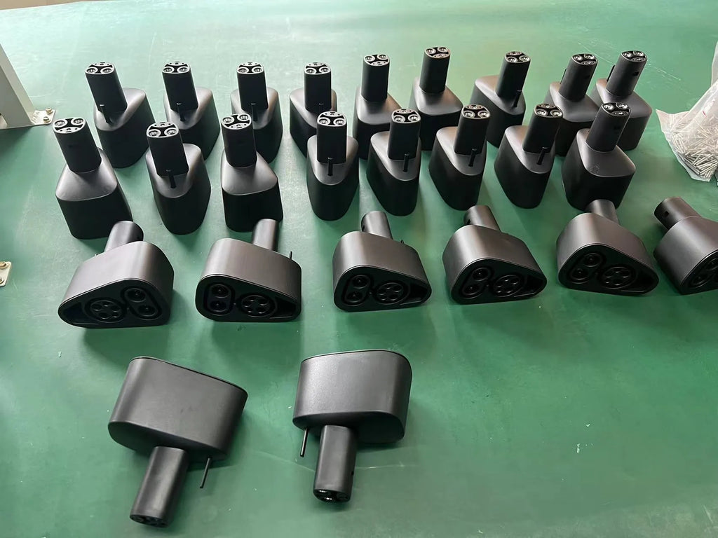 Black Tesla charging plug conversion adaptor for American Standard to UK socket conversion