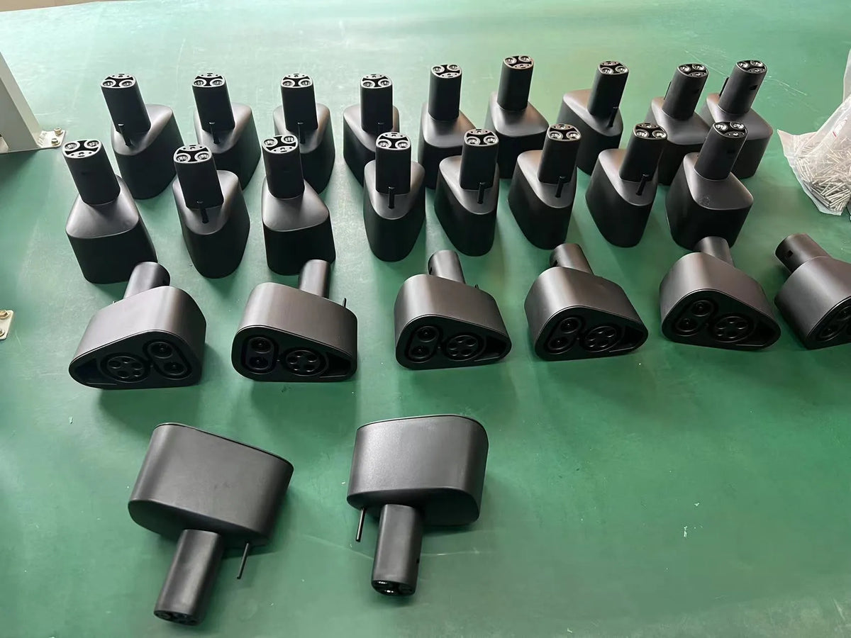 Black Tesla charging plug conversion adaptor for American Standard to UK socket conversion