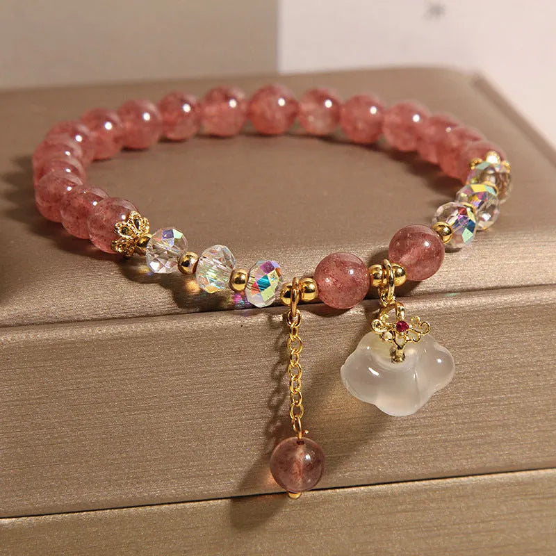 Women's strawberry quartz crystal bracelet with white agate beads and auspicious cloud charms
