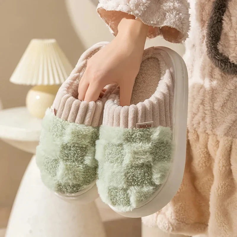 Women's plaid patterned plush slippers with a non-slip PVC sole, shown in a selection of colours including coffee, green, and pink.