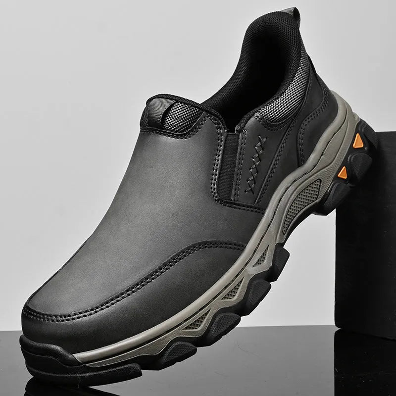 Men's black casual leather-look shoes with round toe and flat rubber sole.