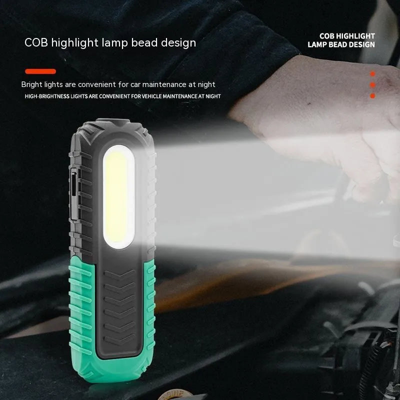 Black and green auto repair work light with USB cable for charging vehicle inspections