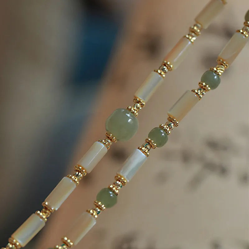 Natural white Hetian jade bead bracelet with geometric round beads on wrist