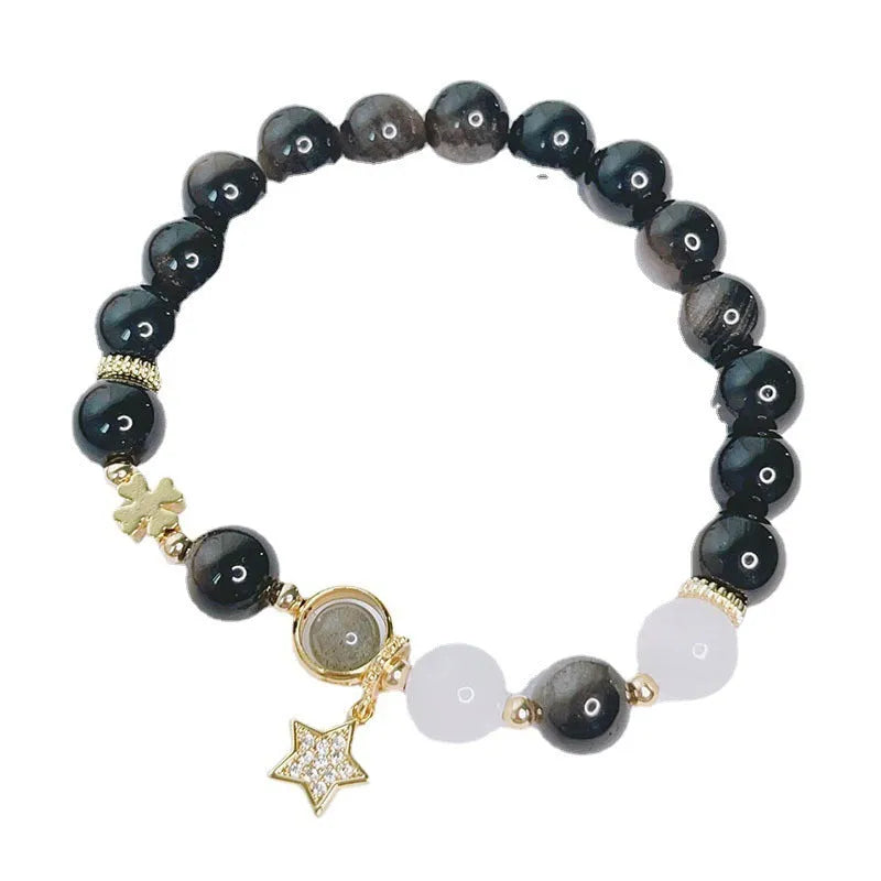 Women's silverstone bracelet with electroplated finish showing floral, love, and star charm designs