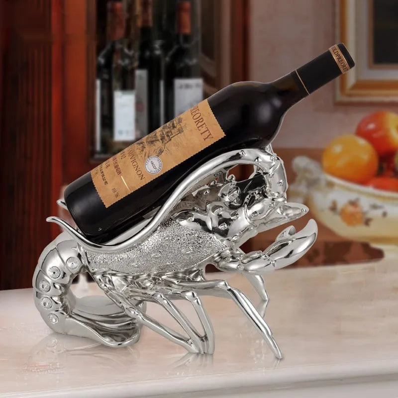 Resin lobster-shaped wine rack ornament in metallic finish holding wine bottle