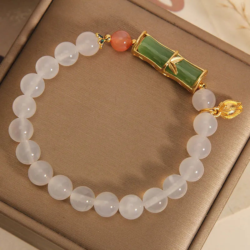 Women's white agate jade bead bracelet with bamboo joint beading in a retro Chinese style.