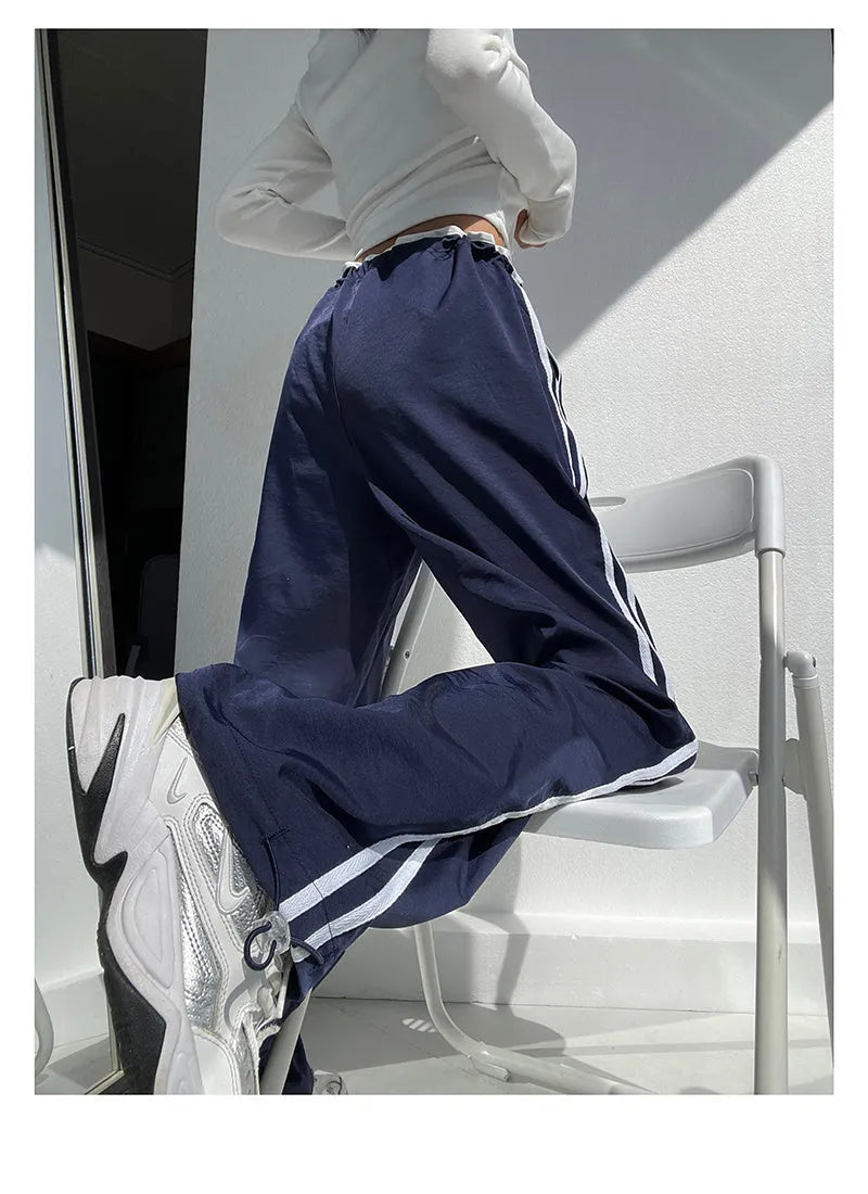 Women's loose straight trousers with ribbon parallel bars detailing in thin draping fabric
