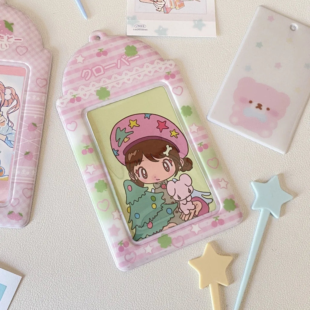 Transparent PVC card holder with cartoon strawberry or four-leaf clover design, measuring 7.6 by 13.6 cm.