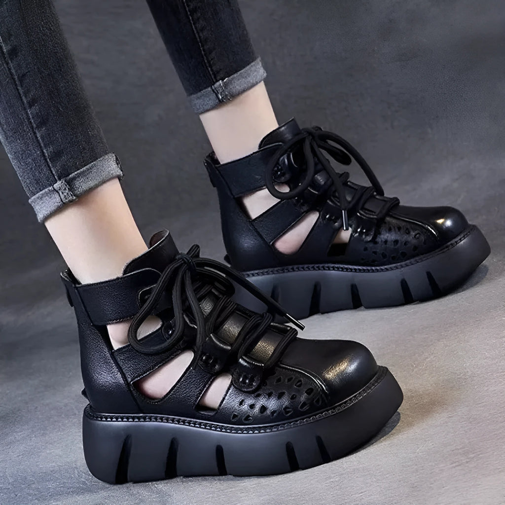 Women's black platform sandals with a hollow-hole leather upper and fish-mouth toe.
