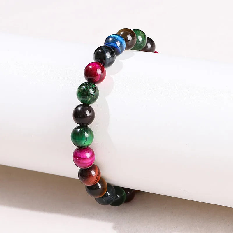Colourful tiger eye bracelet with natural gemstone beads in multiple sizes on mixed string