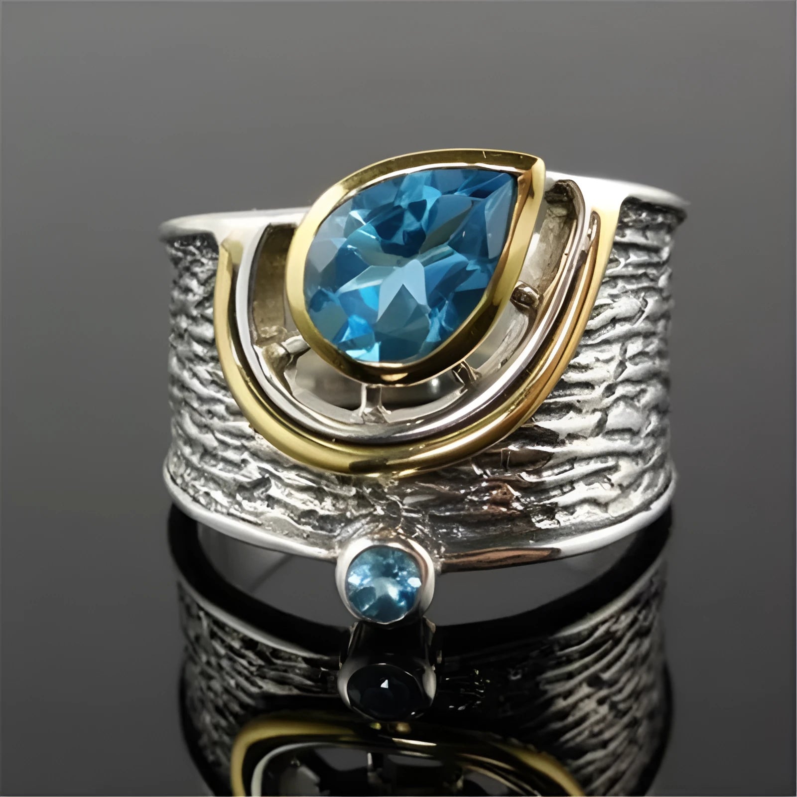 Blue zircon ring with drop shape design and Chinese style influences