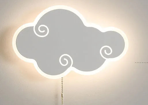 Modern white cloud-shaped acrylic wall lamp mounted on a blue bedroom wall.