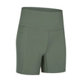 Woman wearing solid colour super stretch cotton blend sports shorts for running.