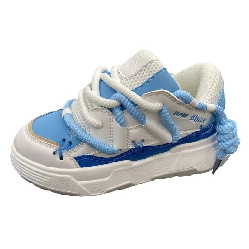 Grey women's chunky retro platform sneakers with thick rubber sole and lace-up front.