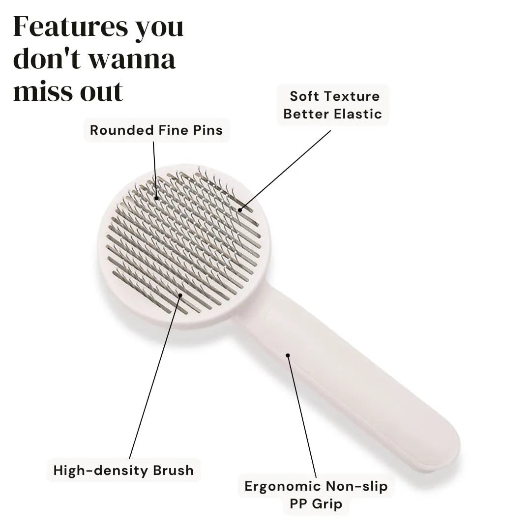 Blue self-cleaning slicker brush for dogs and cats on a wooden surface