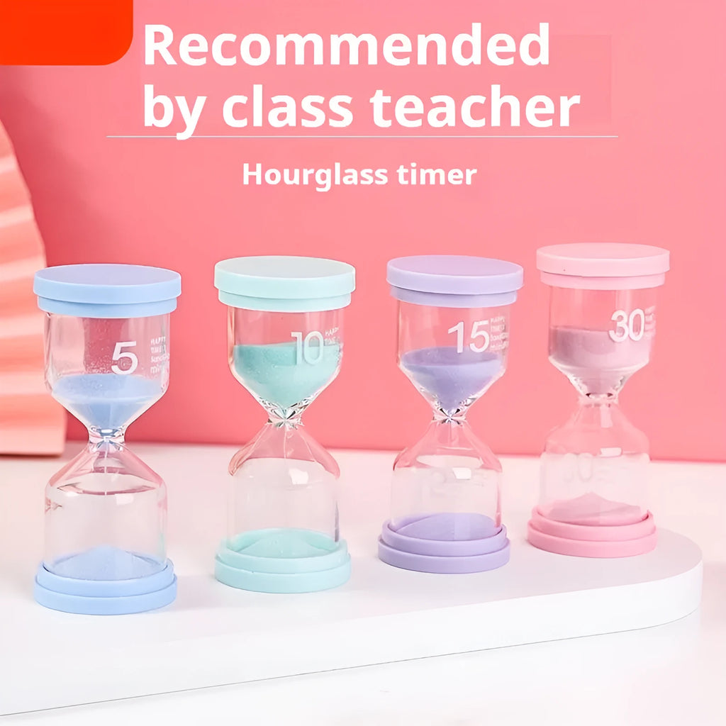 Handmade glass sand timer with coloured purple sand on a wooden desk.