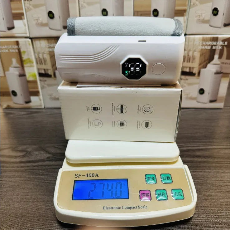 Grey and white portable electric milk warmer for car charger sockets
