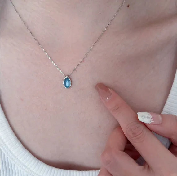 Navy blue water drop pendant necklace with cross chain in electroplated platinum colour finish