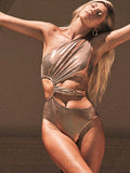 Women's gold backless one-piece swimsuit with sleeveless design for swimming activities