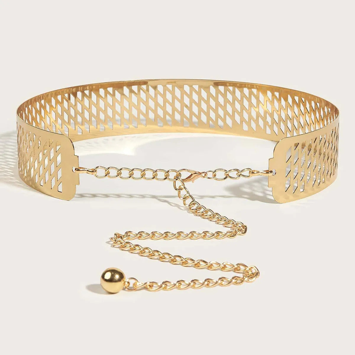 Gold iron waist belt with lantern head decoration, shown with hook clasp and measuring 105cm long.