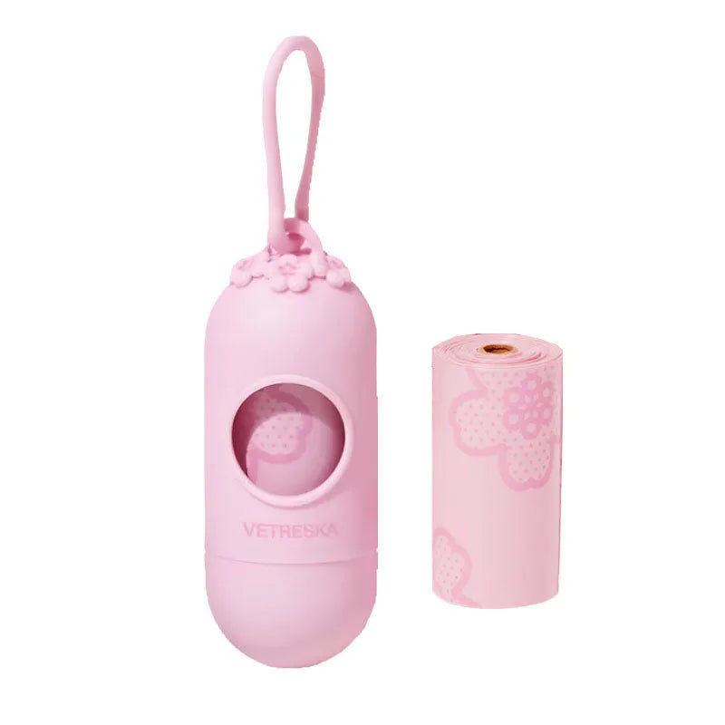 Portable dog poop bag dispenser capsule with scented inner bags in strawberry, orange or cherry blossom colours