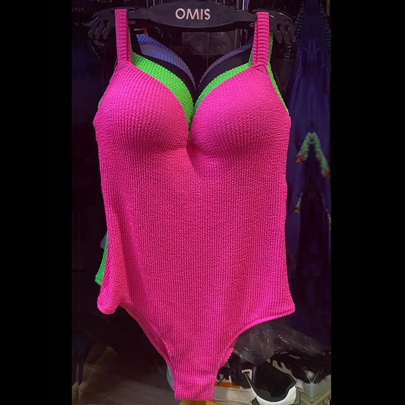 Women's one-piece swimsuit with a sunken stripe pattern in various colours.