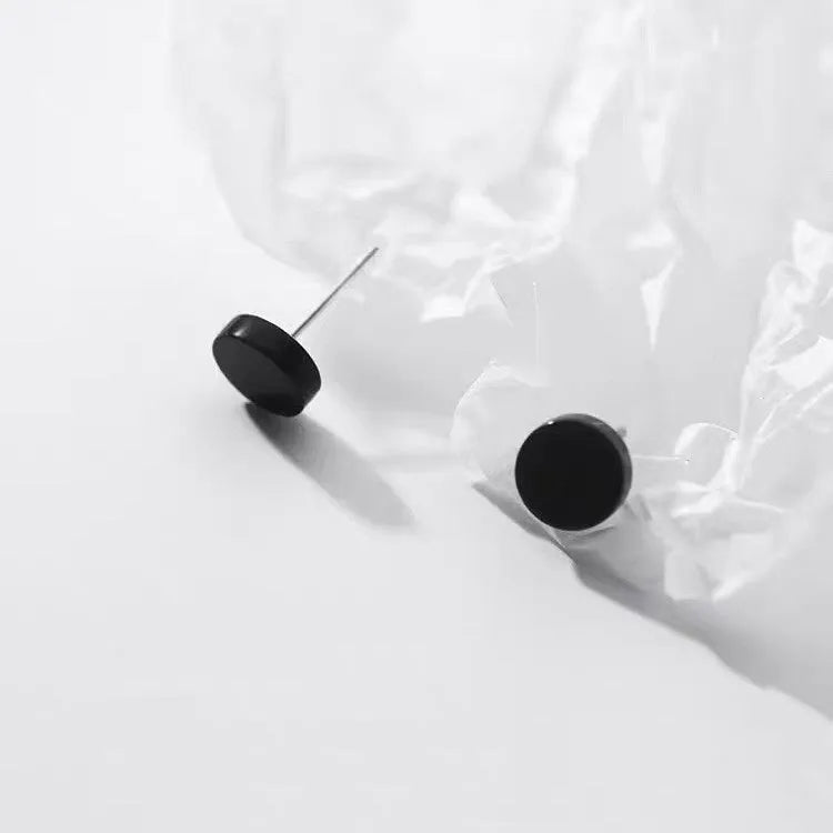 Sterling silver S999 flat bone stud earrings in geometric round shape showing silver and black colour options