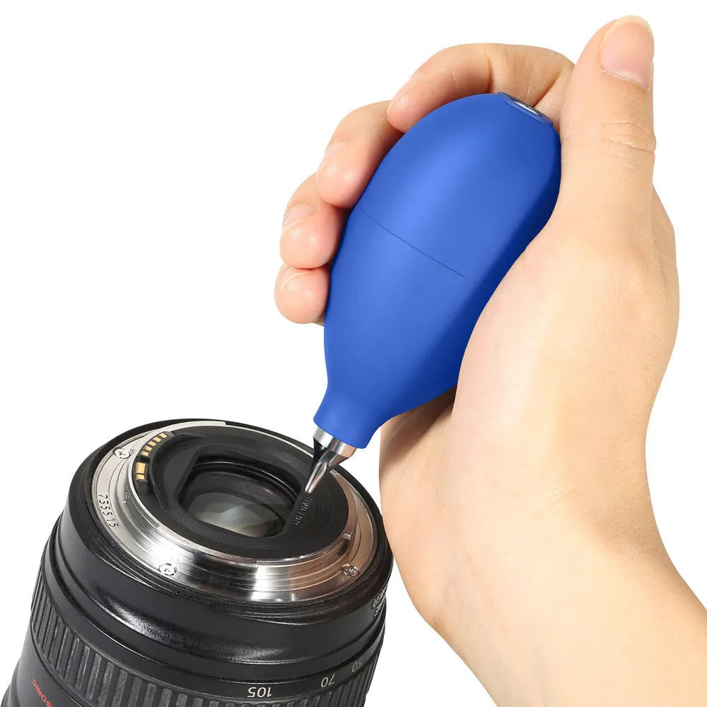 Blue handheld rubber dust removal blower tool for cleaning cameras and phones on a white background.