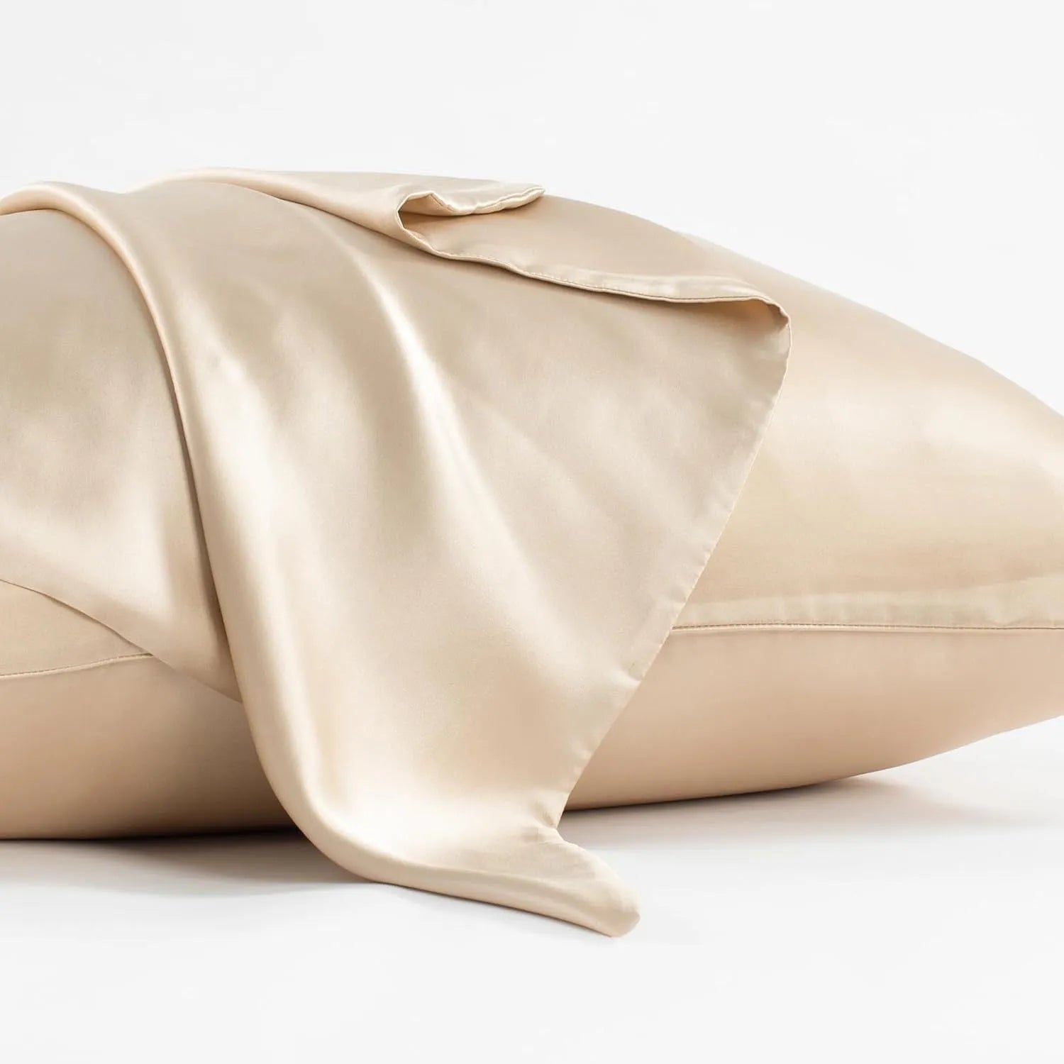 Dark grey 19 momme mulberry silk pillowcase showing envelope closure on a bed.