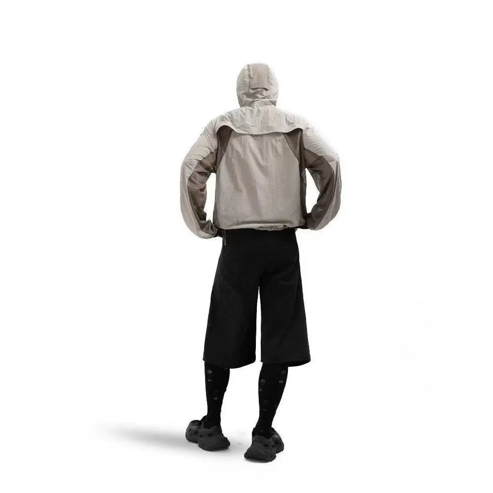 Mesh-stitched sun protective clothing in desert brown, light grey, red or blue.