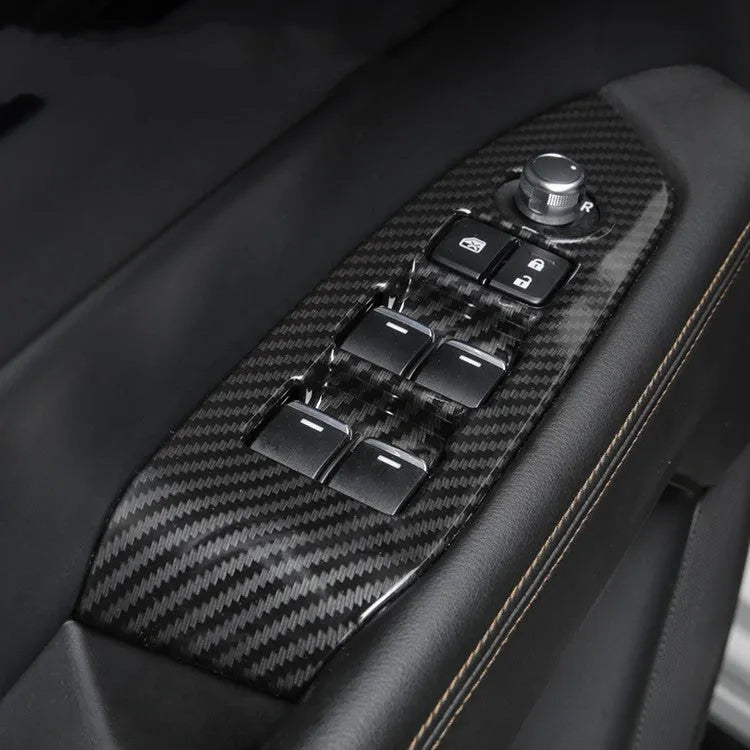 A pair of left and right carbon fibre pattern ABS plastic frames for car steering wheel decoration.