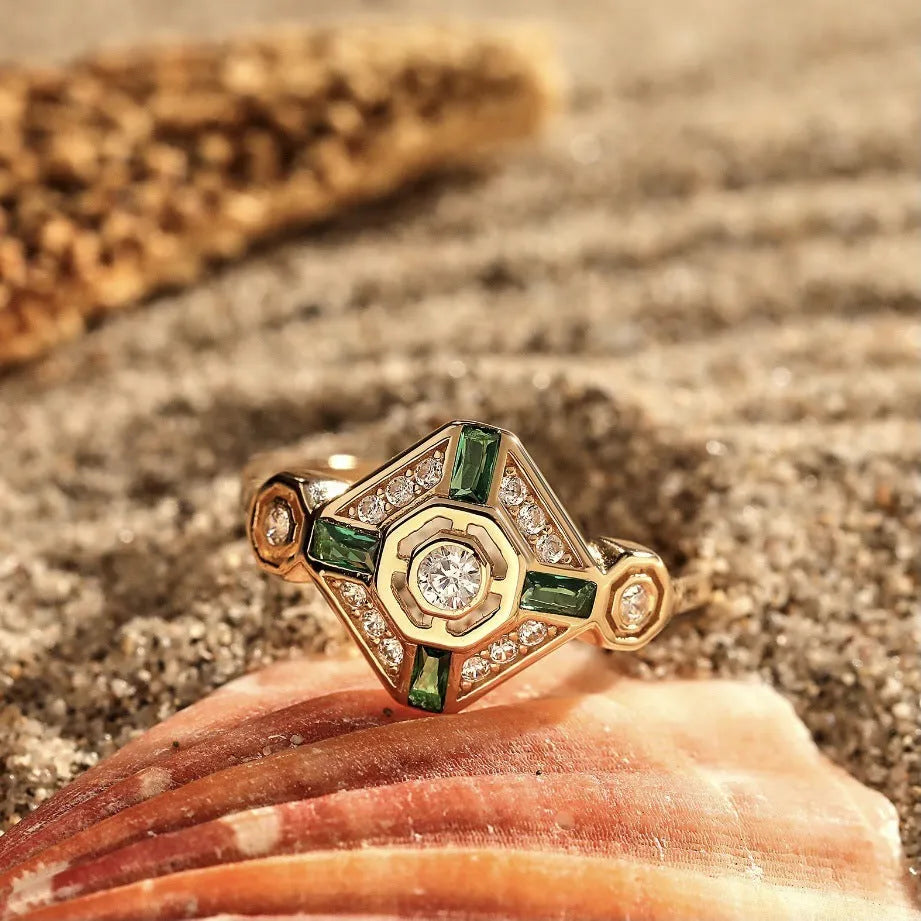 Square-shaped green emerald diamond fashion ring in ins style on a plain background.