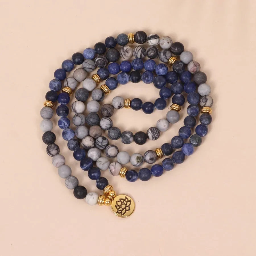 Blue multi layer bracelet with patterned network stone beads and alloy construction