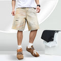 Light blue distressed denim shorts for men with straight-leg cut and mid-waist fit