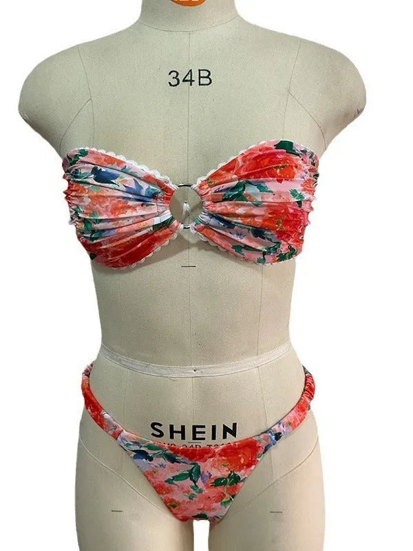 Floral print blue bikini tube top with lace trim and backless design for swimming.