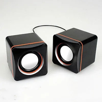Small black square 2.0 computer speaker with USB power cable for desktop and laptop use.