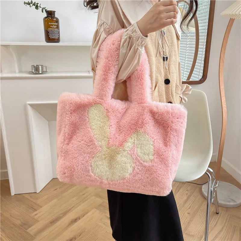 Cartoon rabbit ears design on a solid colour plush tote bag for women.