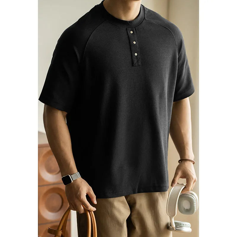 Women's loose grey casual top with raglan sleeves and a terry texture fabric.
