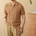 Light brown cotton cardigan top with lapel collar, short sleeves, and a centre front zipper on a hanger.