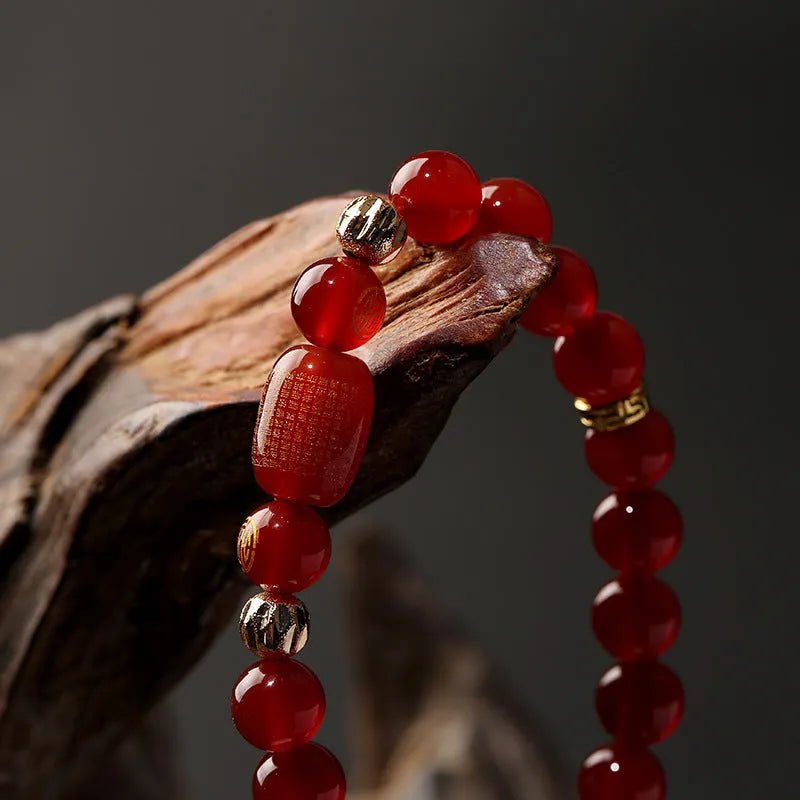 A new Chinese style agate Guanyin bracelet rosary with auspicious patterns, shown in green and red colour options.