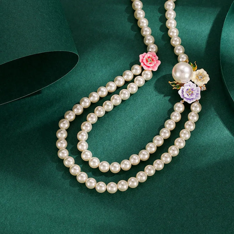 Enamel glaze diamond three-colour rose double-layer pearl necklace for women on display