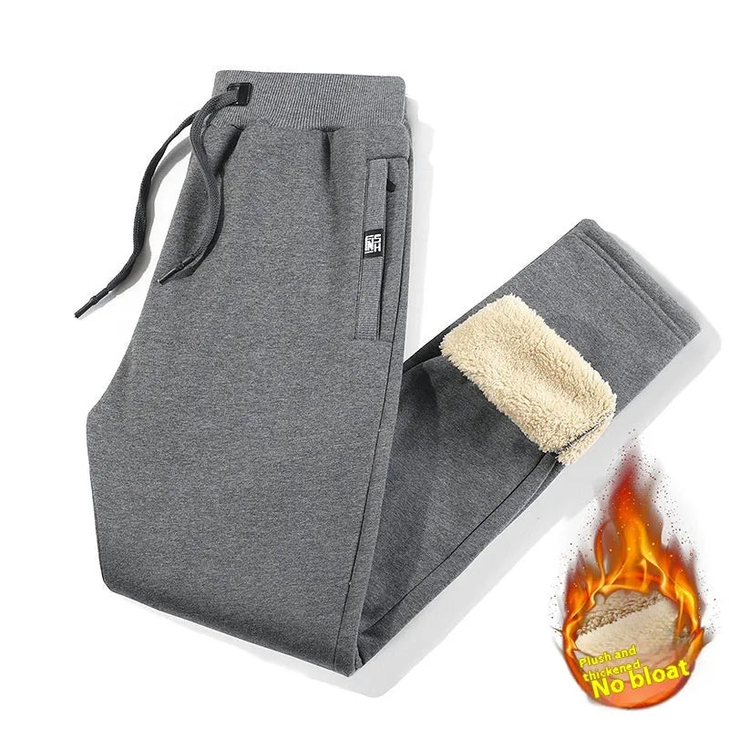 Men's gray fleece-lined oversized track pants with elastic waistband and straight leg