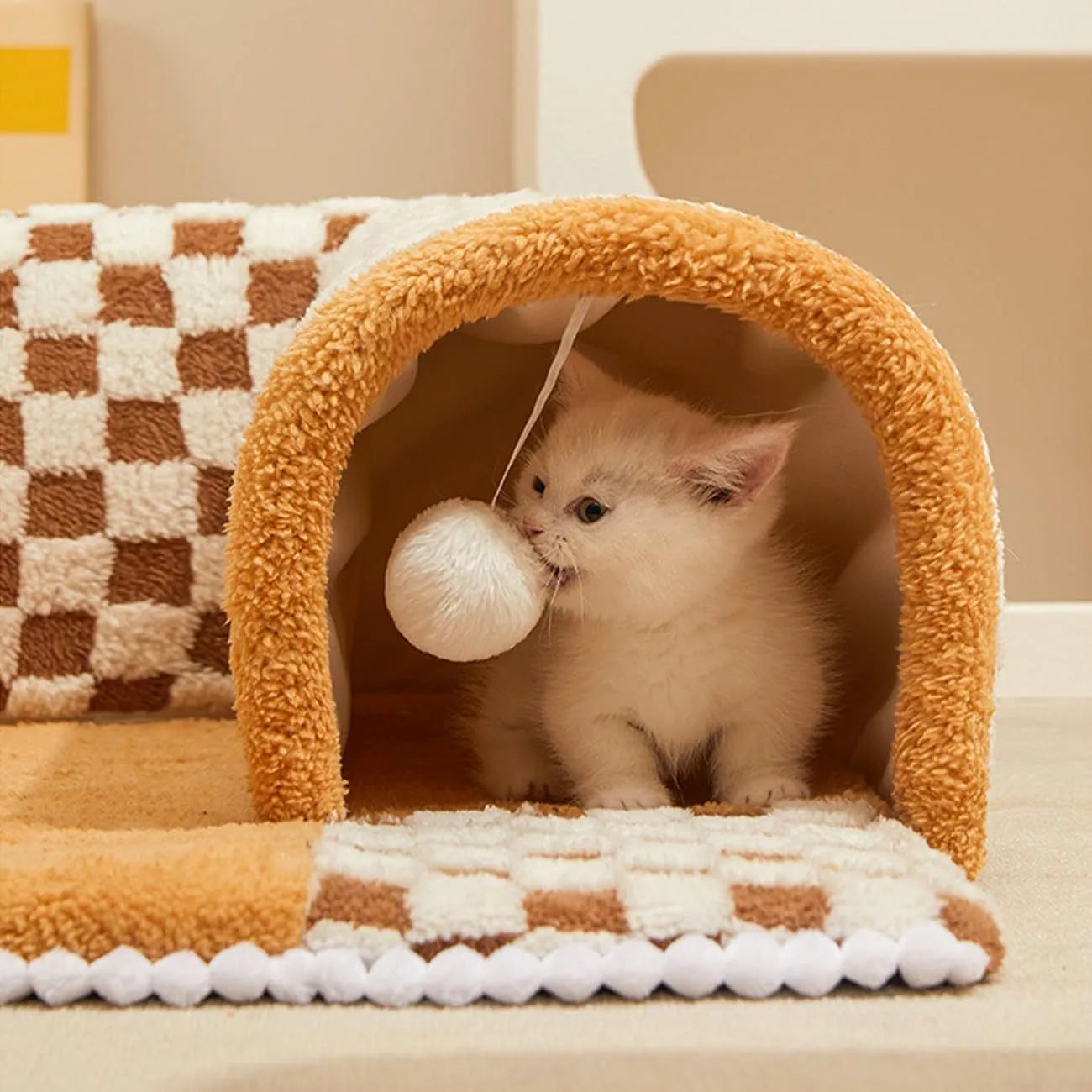 Fan-shaped plush pet bed with integrated tunnel in yellow, showing soft fabric and anti-slip base.