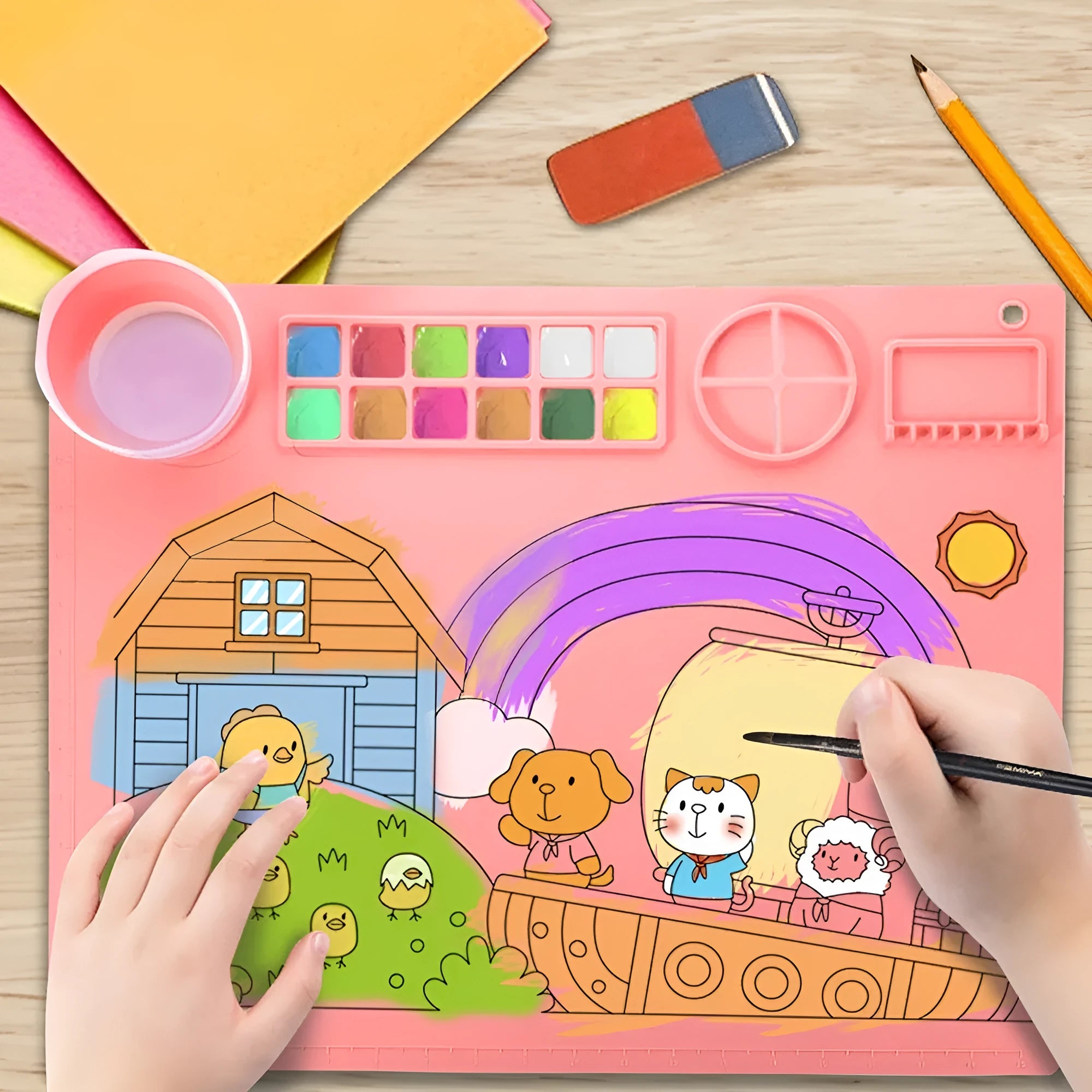 Light blue silicone painting mat with two built-in bowls, sized 50 by 40 centimetres.