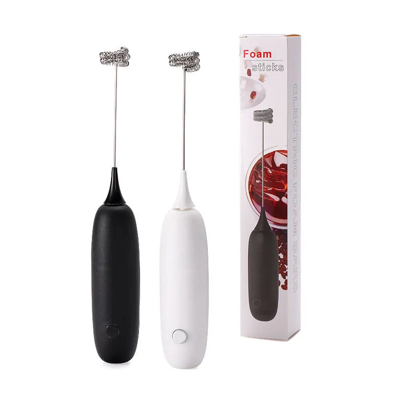 Black and white handheld electric milk frother with modern design for coffee preparation