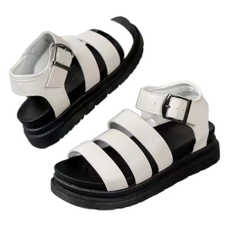 Black casual beach sandal with a thick rubber sole and a silver buckle strap on a PU upper.